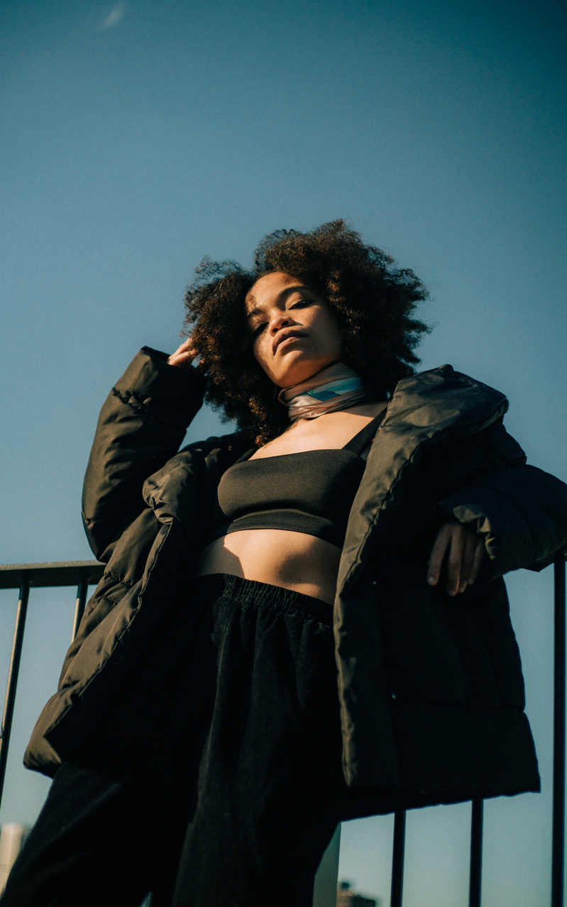 Woman Wearing Black Crop Top and Black Pants